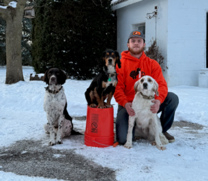 Poo Squad Champaign IL owner with his dogs in the snow, representing local dog poop cleanup service